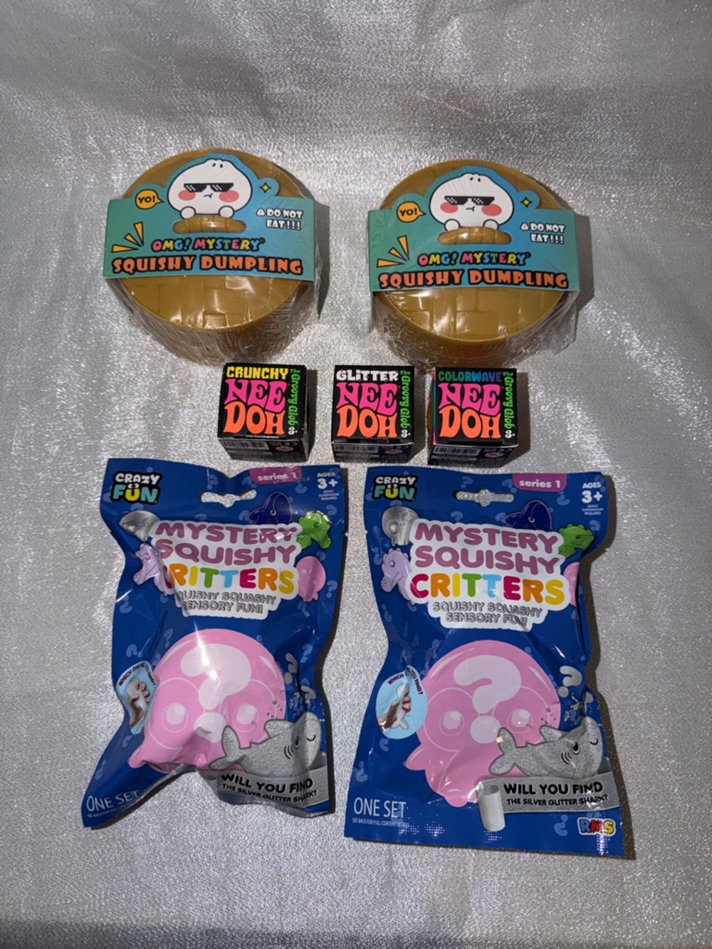 1 NeeDoh, 2 OMG Mystery Dumplings & 2 Crazy Fun Squishy Critters Mystery Bags